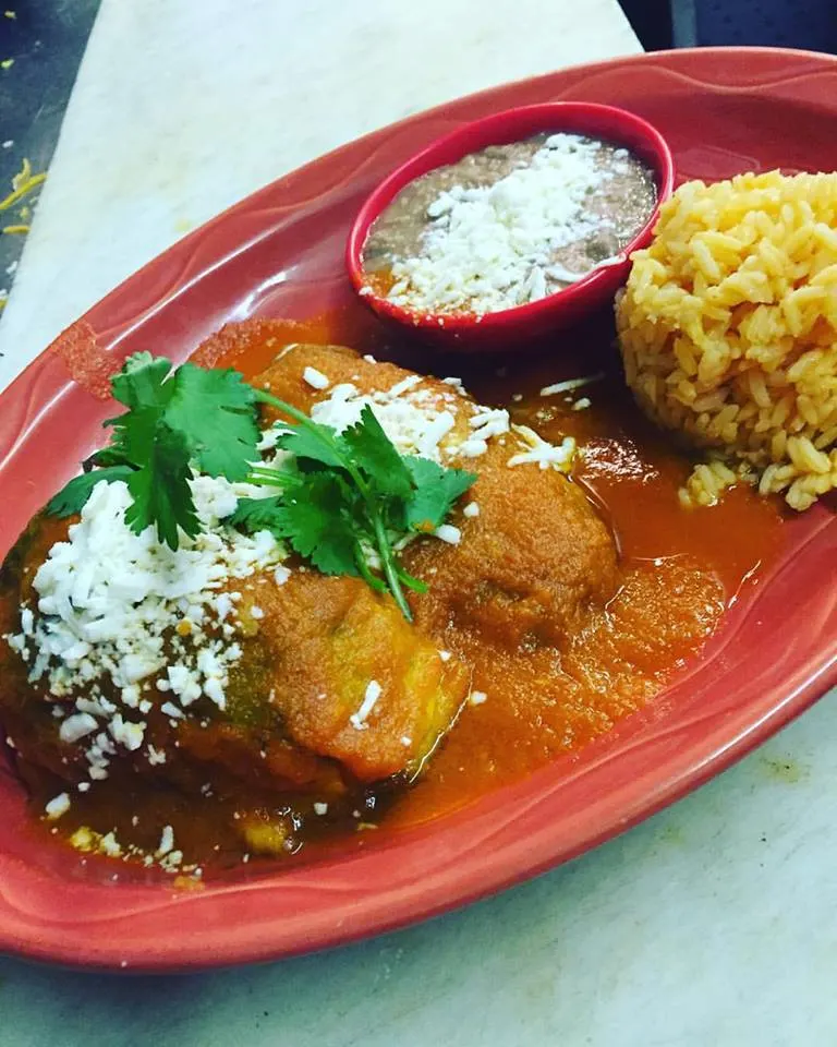 Chiles rellenos served with rice and beans