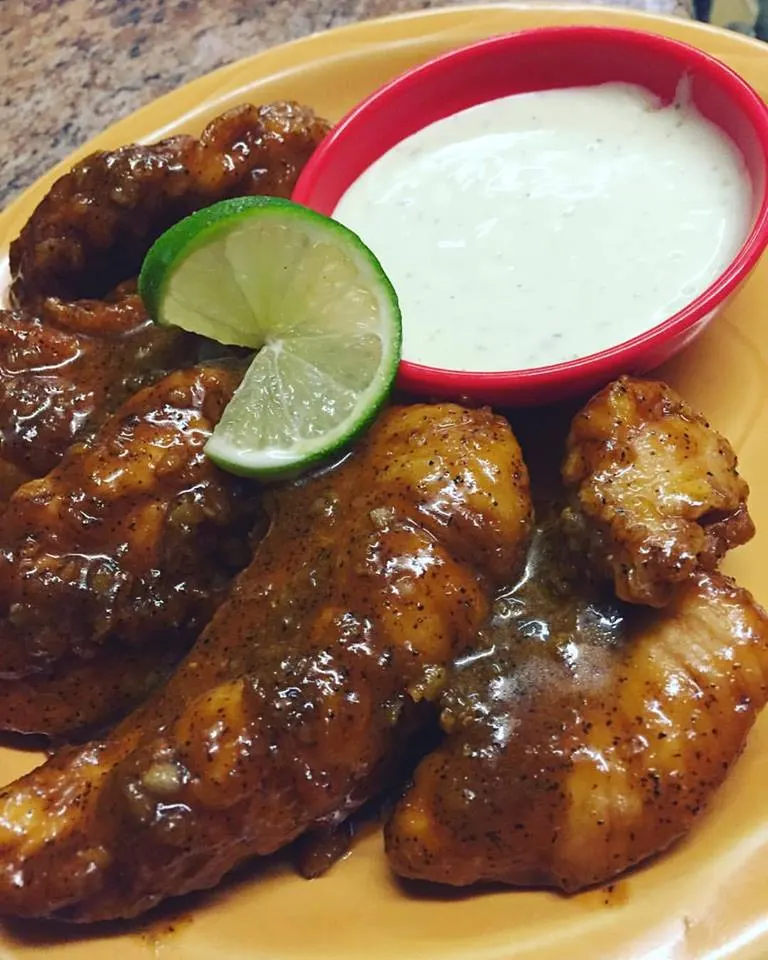 El Coyote tequila lime tenders with dipping sauce and lime